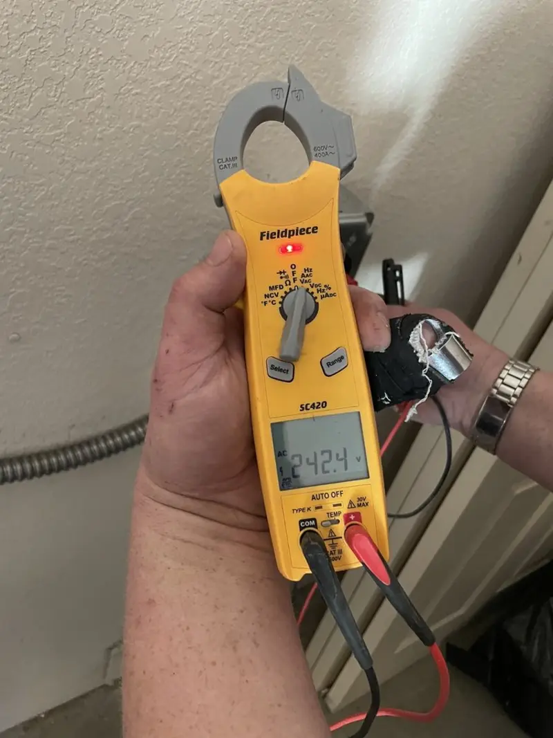 Voltage testing with clamp meter during Circuit Breaker Repair in Vero Beach